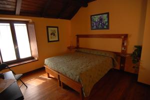 Tempat tidur dalam kamar di Agriturismo Torrazzetta