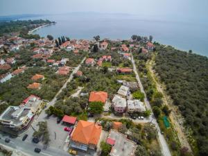 an aerial view of a city with houses and the water at Alkifron Hotel in Kala Nera