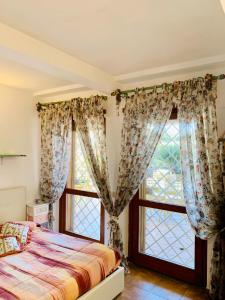 Katil atau katil-katil dalam bilik di L'affittacamere nel parco "Appia Antica "