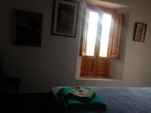 Postel nebo postele na pokoji v ubytování Cortijo Urrá Manor House, Sorbas