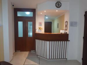 a lobby with a reception desk in a building at Hotel Nadai in Mar del Plata