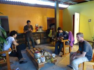 a group of people sitting in a room at Monkeywasi Climbing Hostel in Huaraz