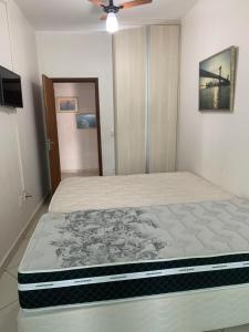 En eller flere senge i et værelse på Suítes Dona Paris