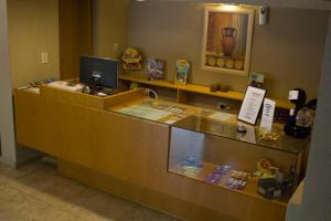 a reception desk in a hotel room with a cash register at Solares Cumbrecita Hotel & Apart in La Cumbrecita