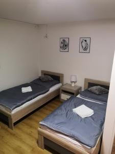 En eller flere senge i et værelse på Penzion Ubytování u Parku s parkovištěm
