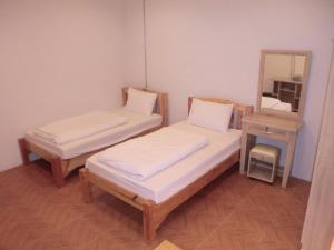 Postel nebo postele na pokoji v ubytování Sakura House