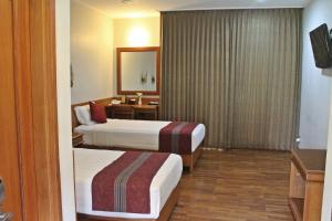 Tempat tidur dalam kamar di Manohara Resort