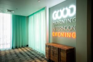 a room with a sign that reads good morning afternoonuing at Hotel Indigo - Madison Downtown, an IHG Hotel in Madison