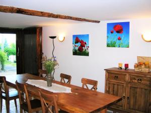 a dining room with a wooden table and chairs at Le Relais du Vialaron in Villard