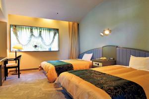 Lova arba lovos apgyvendinimo įstaigoje The Gran Resort Princess Arima