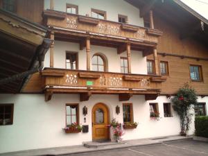 a building with a balcony on top of it at Appartementhaus Angelika in Stumm