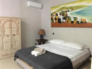 Säng eller sängar i ett rum på Résidence Marina Beach