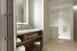 a bathroom with a sink, toilet and bathtub at Hotel Indigo Atlanta Downtown, an IHG Hotel in Atlanta