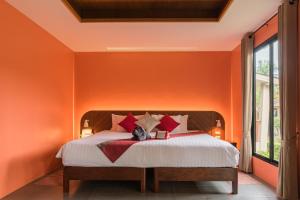 Ein Bett oder Betten in einem Zimmer der Unterkunft Anda Lanta Resort