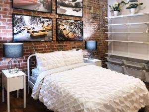 מיטה או מיטות בחדר ב-Downtown Spectrum - Location - Comfort - Style