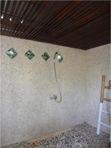 a bathroom with a shower in a wall at Le Kekeri Villas Collection in Mataram