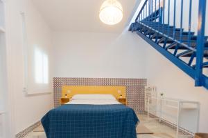 Letto o letti in una camera di BOHEMIA SANLUCAR