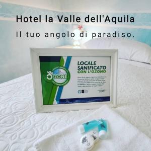 a picture of a hotel la value del apuilla with a bottle of soap at Hotel La Valle dell'Aquila in LʼAquila