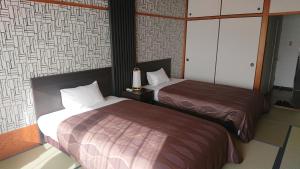 Letto o letti in una camera di The Gran Resort Arima