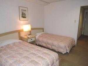 Letto o letti in una camera di The Gran Resort Arima