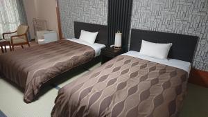 Letto o letti in una camera di The Gran Resort Arima
