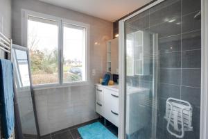 a bathroom with a shower and a glass shower stall at Ti Cairn in Moëlan-sur-Mer +11 photos