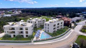 an aerial view of a building with a swimming pool at The Blueview Appartements Novigrad in Novigrad Istria