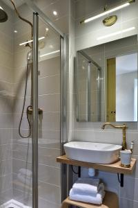 a bathroom with a sink and a shower at A Bella Scusa in Bastelica