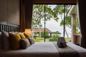 Ein Bett oder Betten in einem Zimmer der Unterkunft Anda Lanta Resort