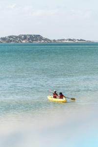 two people in a kayak on a body of water at PK25 Dakhla in Dakhla
