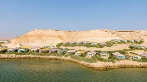 a group of houses on an island in the water at PK25 Dakhla in Dakhla