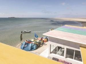 a group of chairs on a beach next to the water at PK25 Dakhla in Dakhla