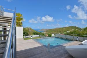 a house with a swimming pool and a balcony at Dream Villa Flamands 744 in Anse des Cayes