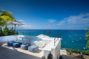a view of the ocean from a resort balcony at Dream Villa Corossol 816 in Gustavia