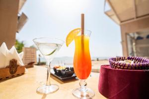 two cocktails sitting on top of a table at PK25 Dakhla in Dakhla