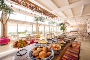 a long table with many plates of food on it at PK25 Dakhla in Dakhla