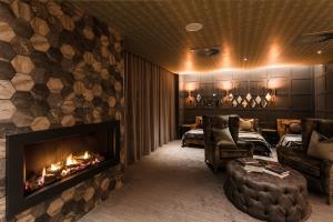 a living room filled with furniture and a fire place at Lodore Falls Hotel & Spa in Keswick