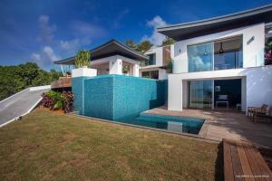 a house with a blue fence in front of it at Dream Villa St Jean 891 in Saint Barthelemy