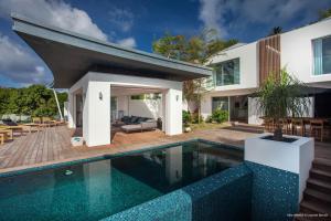 a swimming pool in front of a house at Dream Villa St Jean 891 in Saint Barthelemy