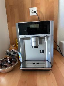 a coffee machine sitting on top of a table at Good Bed Reiden in Reiden
