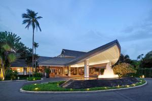 a building with a staircase leading up to it at Melia Koh Samui in Choeng Mon Beach