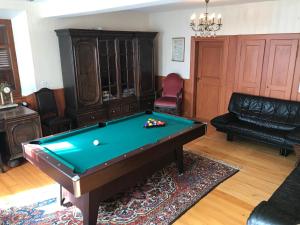 a living room with a pool table in it at Maison Zielinger in Petersbach