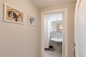 a bathroom with a sink and a mirror at Rome as you feel - Grotta Pinta apartments in Rome