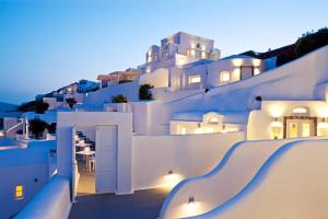 a view of a white building at night at Canaves Oia Boutique Hotel in Oia