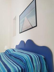 Postel nebo postele na pokoji v ubytování ANFORA Blu