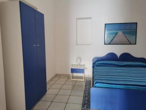Postel nebo postele na pokoji v ubytování ANFORA Blu