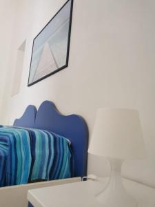 Postel nebo postele na pokoji v ubytování ANFORA Blu