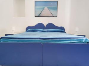 Postel nebo postele na pokoji v ubytování ANFORA Blu