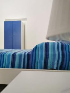 Postel nebo postele na pokoji v ubytování ANFORA Blu