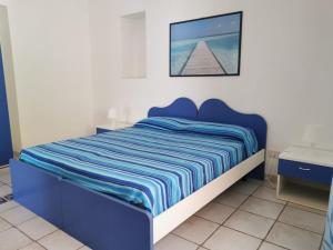 Postel nebo postele na pokoji v ubytování ANFORA Blu